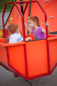 Sister and brother riding the rides