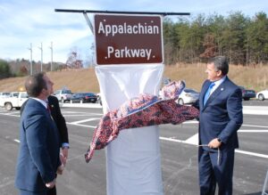 White County Commission Chairman Travis Turner, State Representative Terry Rogers and State Senator Steve Gooch unveil the new Appalachian Parkway road sign (Photo: Dean Dyer/wrwh.com)