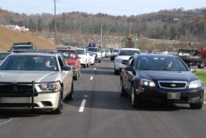 White County Sheriff (L) and Cleveland Police Chief John Foster (R) lead special escort of first vehicles to officially ride on the Appalachian Parkway.
