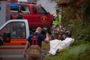 Public safety officials and public works crews spent the day Thursday removing bodies and debris from the crash site.