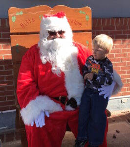 Gauge Miller, 4, of Clarkesville, considers telling Santa what he wants for Christmas at the Cornelia Depot Saturday.