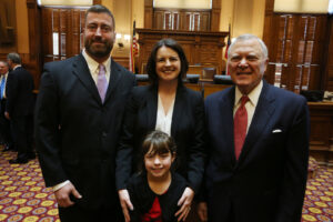 Judge Amanda Mercier and family with Gov. Deal following her swearing-in ceremony on Dec. 29, 2015.