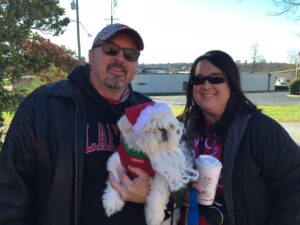 Gizmo and his parents Jonathan and Kristine Fitzpatrick of Clarkesville came ready for a parade. Warm sweater? Check. Santa hat? Check. Doggie beard? Check. Coffee? Oh, yeah!