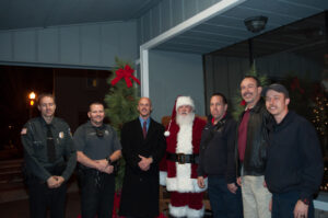 Santa celebrates the season with, from left to right, Demorest Police Officer Jamie Bowdon, Officer Casey Chastain, Mayor Rick Austin, Fire Chief Ken Ranalli, Police Chief Greg Ellingson and Firefighter Justin Hicks.