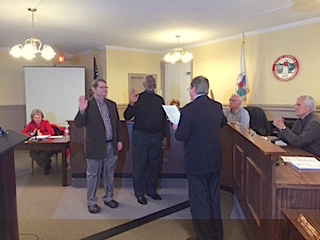 Wesley Dodd (standing, on left) was sworn in again as Ward 1 Commissioner, and Tony Cook (center) was sworn in again as Ward 4 Commissioner, for the City of Cornelia Tuesday night by City Attorney Steve Campbell at the city's Commissioner meeting.