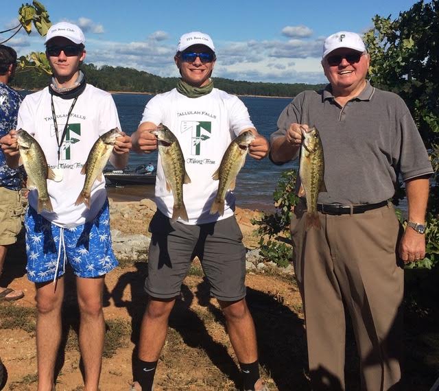 Wendy Jackson/Special TFS Bass Fishing Club members sophomore Marshall Harrelson and freshman Marshall Williams, along with TFS President and Head of School Larry A. Peevy show off their catch at an Oct. 8 tournament held at Lake Hartwell.