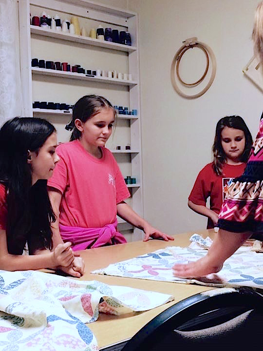 Girls in Action (GAs) at Clarkesville Baptist Church make bandanas to help firefighters battling wildfires in Rabun County. (photo/Mandy Ellington)