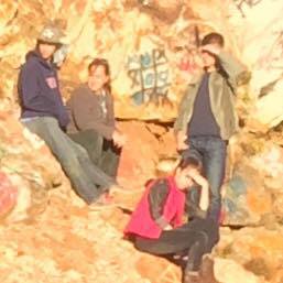 The unidentified person on the far left of this photo (wearing a hat and blue sweatshirt) is considered a person of interest by authorities in a rock-throwing incident that seriously injured a Clarkesville teenager on Nov. 9 on Bell Mountain in Towns County.
