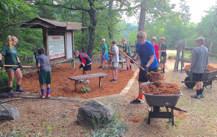 spreading mulch along the south rim trails
