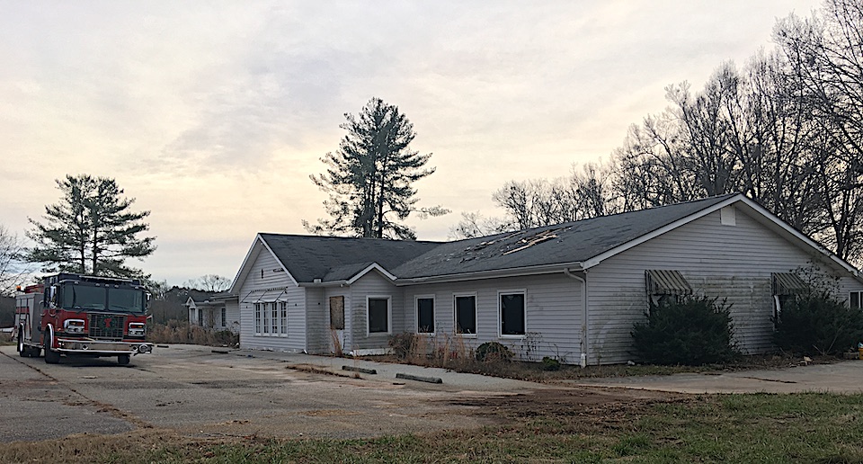 Fire truck outside old Runway Fish House