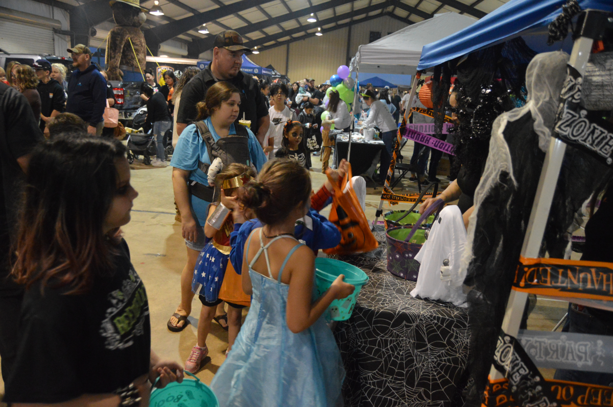 Trick or treaters wait for candy