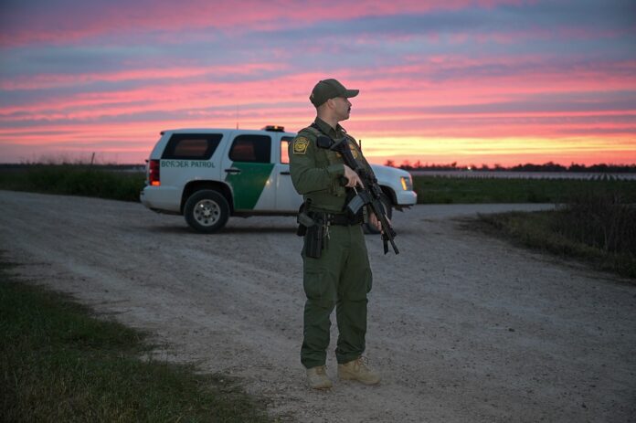 Border Patrol officer standing guard in Rio Grande Valley