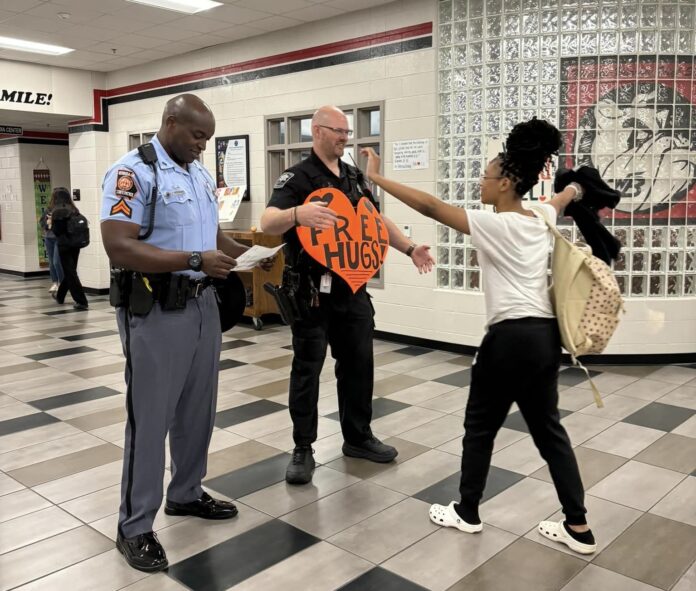 student hugs at Winder Barrow High School