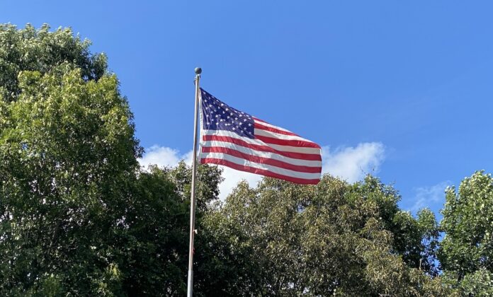 American flag blowing in wind