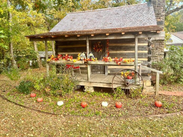 Historic English cabin at Mauldin House Gardens decorated for fall