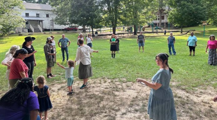 folks in circle on lawn